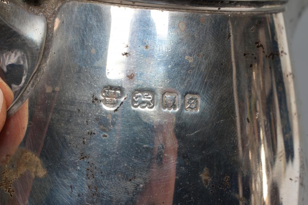 A SILVER HOT WATER JUG Image