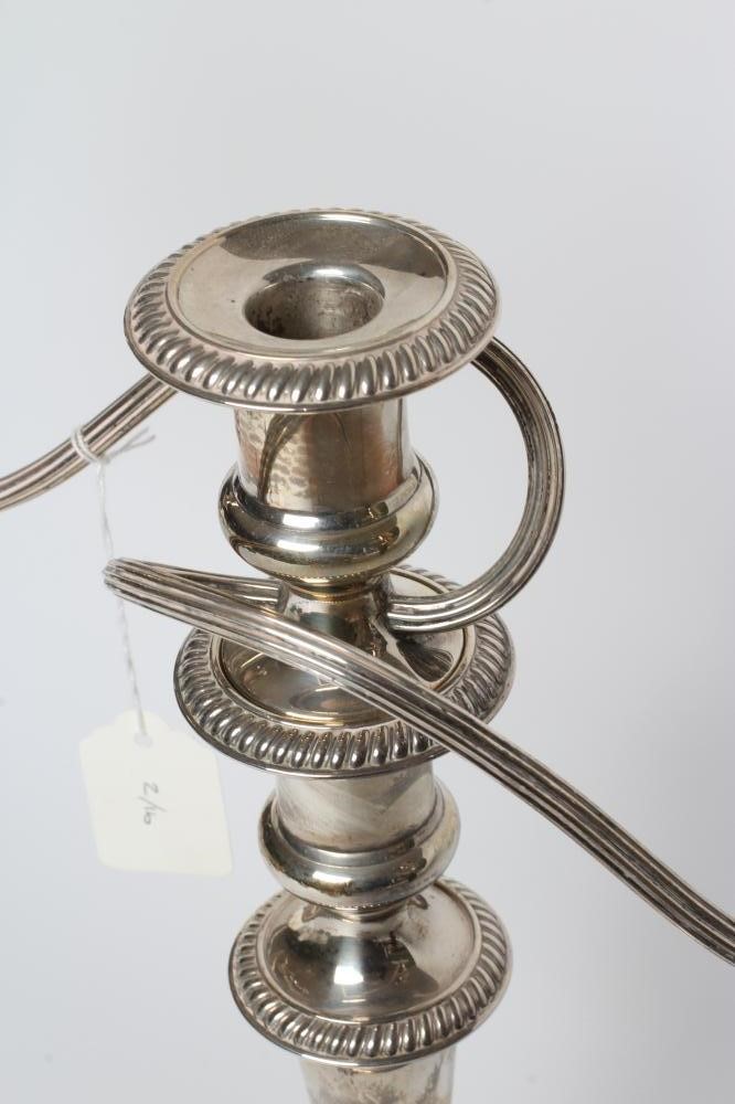 A TWO BRANCH THREE LIGHT SILVER CANDELABRUM Image