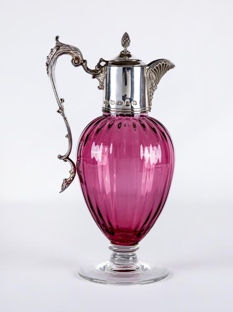 A SILVER MOUNTED CRANBERRY GLASS CLARET JUG Image