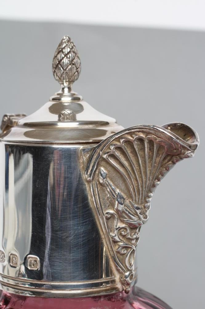 A SILVER MOUNTED CRANBERRY GLASS CLARET JUG Image