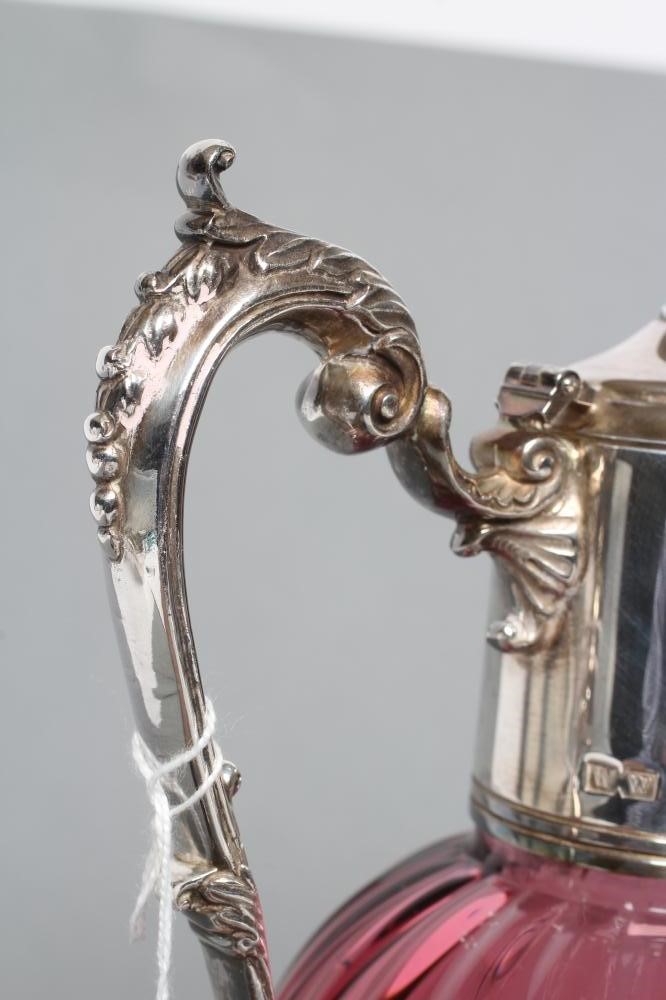 A SILVER MOUNTED CRANBERRY GLASS CLARET JUG Image