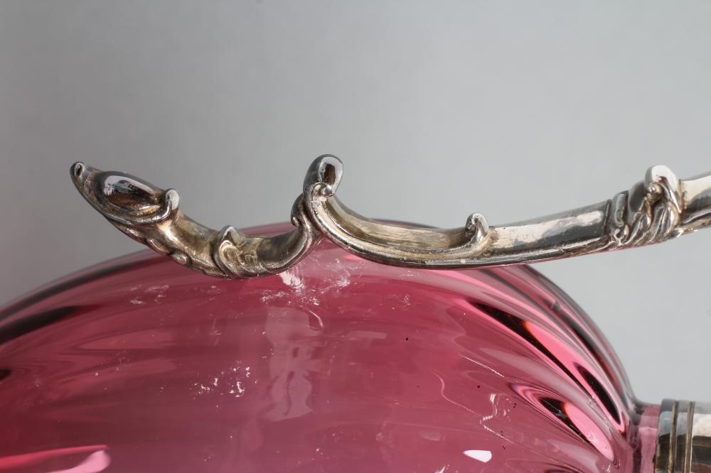 A SILVER MOUNTED CRANBERRY GLASS CLARET JUG Image