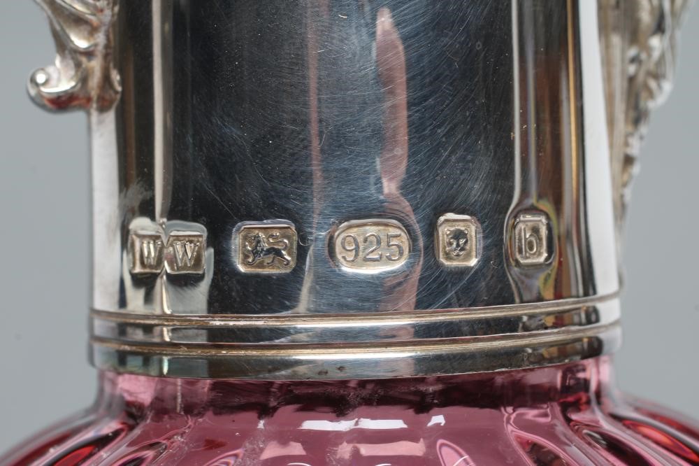 A SILVER MOUNTED CRANBERRY GLASS CLARET JUG Image