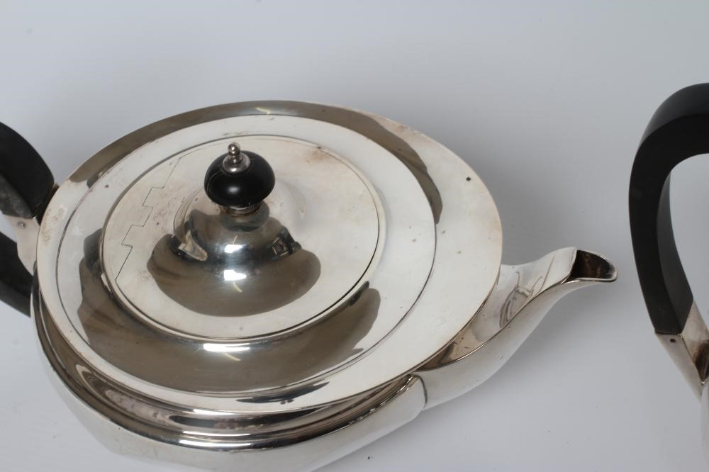 A FOUR PIECE SILVER TEA AND COFFEE SERVICE Image