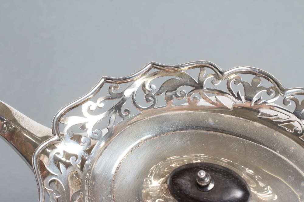 A SILVER TEAPOT Image