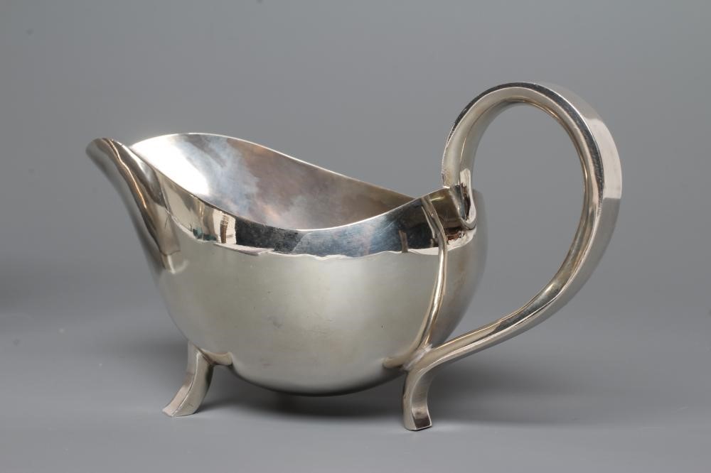 A SIILVER MILK JUG Image