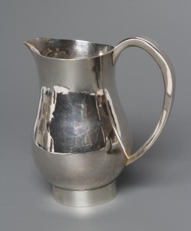 A SIILVER MILK JUG Image