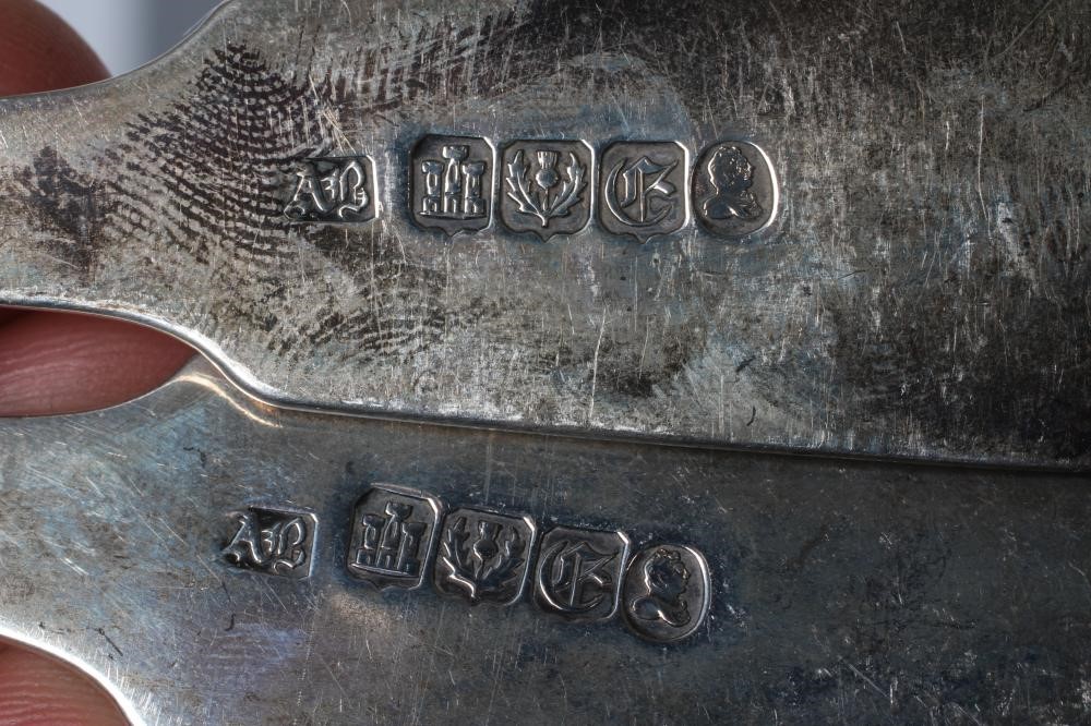 A SET OF THREE GEORGE II SILVER TABLESPOONS Image