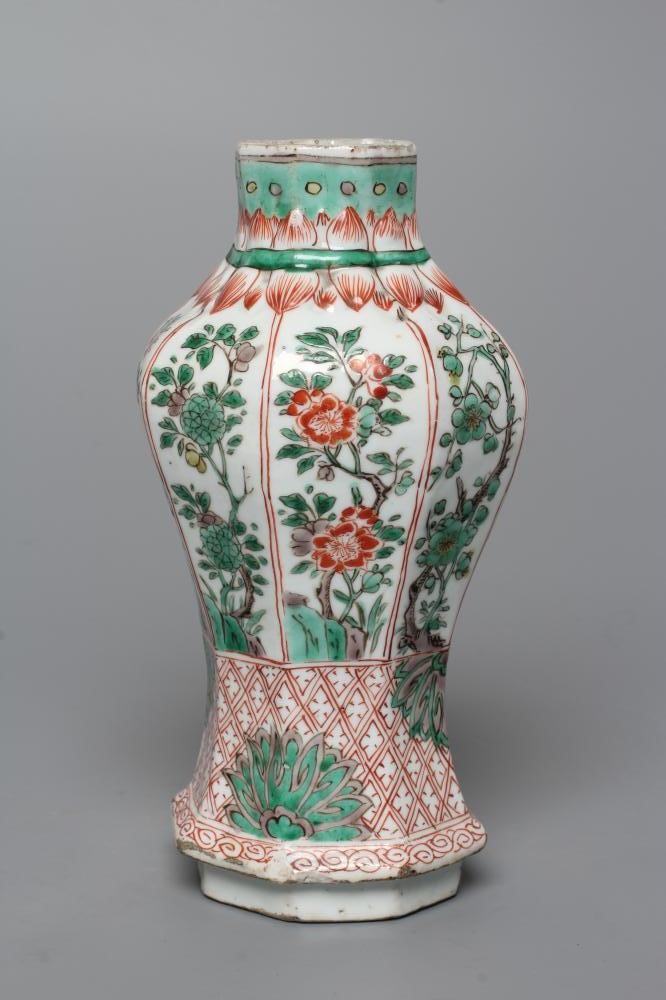 A CHINESE PORCELAIN FAMILLE VERTE VASE of octagonal inverted baluster form, painted with panels of Image