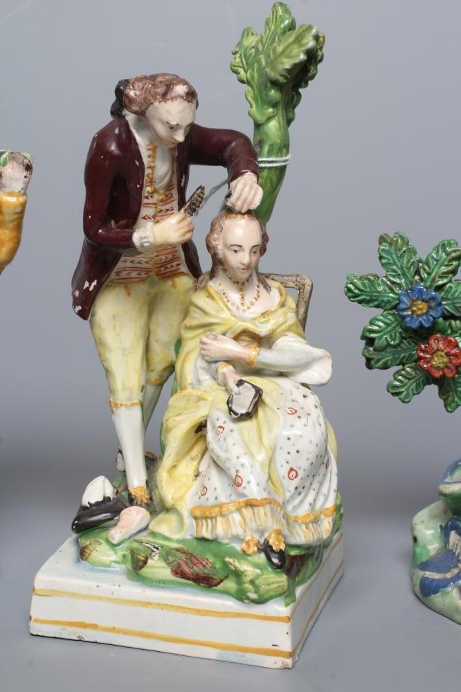 A STAFFORDSHIRE PEARLWARE FIGURE GROUP Image