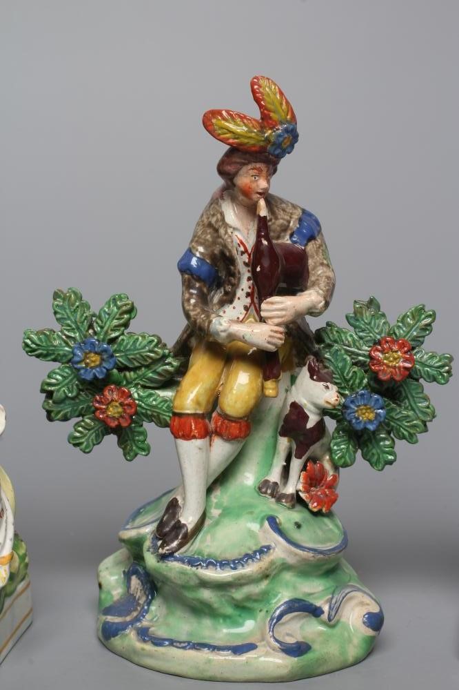 A STAFFORDSHIRE PEARLWARE FIGURE GROUP Image