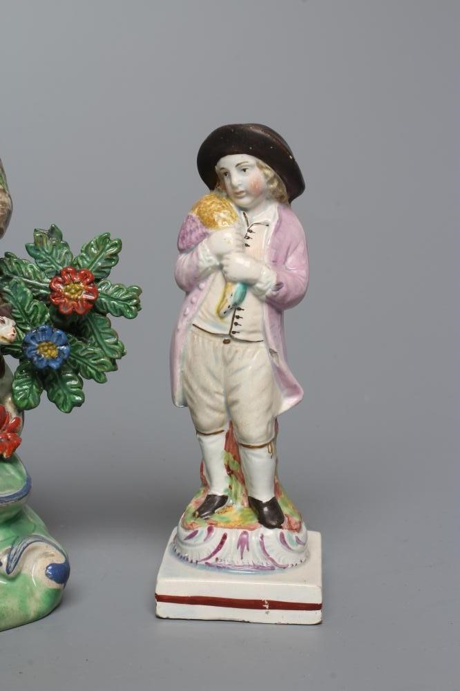 A STAFFORDSHIRE PEARLWARE FIGURE GROUP Image