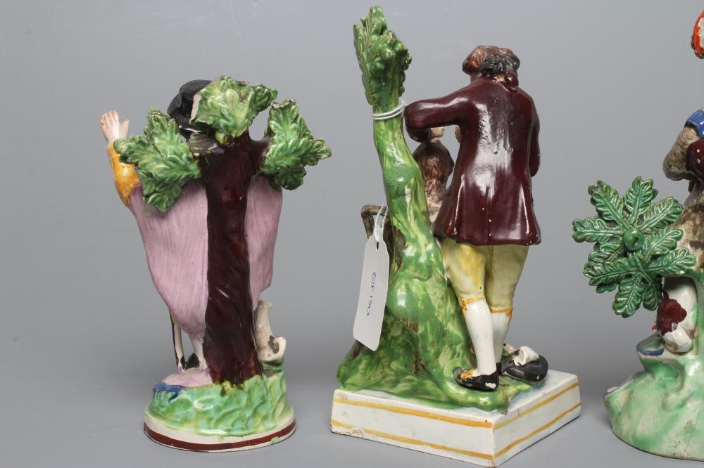 A STAFFORDSHIRE PEARLWARE FIGURE GROUP Image