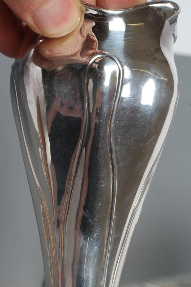 A PAIR OF EDWARDIAN ART NOUVEAU SILVER VASES Image