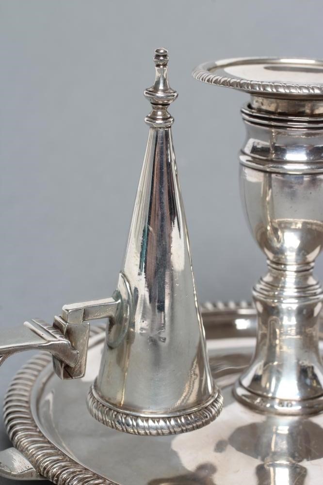 A LATE GEORGE III SILVER CHAMBERSTICK Image