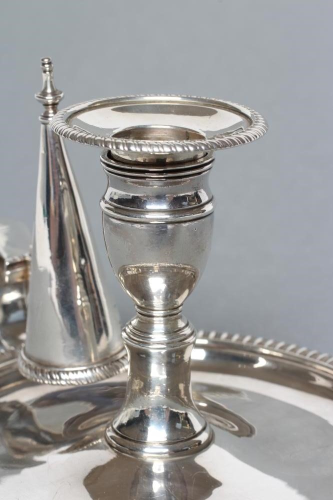 A LATE GEORGE III SILVER CHAMBERSTICK Image