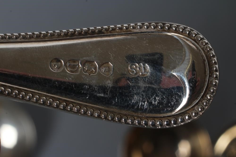 A SET OF FIVE VICTORIAN SILVER SAUCE LADLES, maker Thomas Smiley, London 1879, in bead pattern, 6" Image