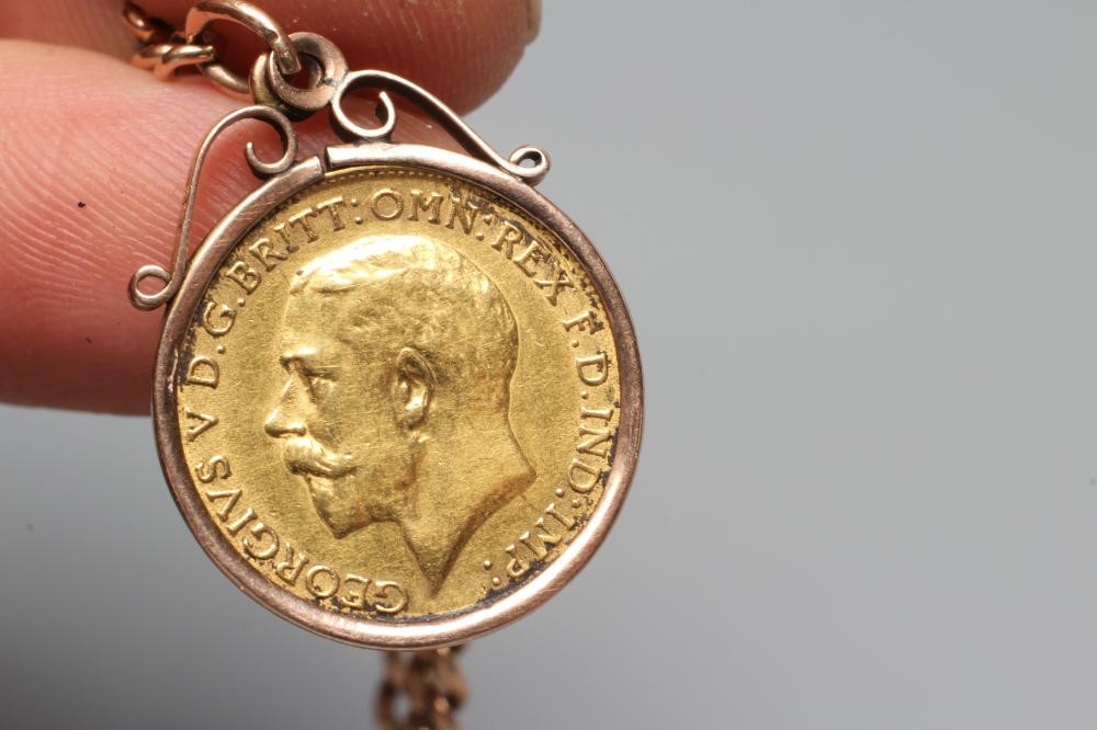 A GEORGE V HALF SOVEREIGN, 1912, in a 9ct gold loose mount and pendant from a graduated curb link Image