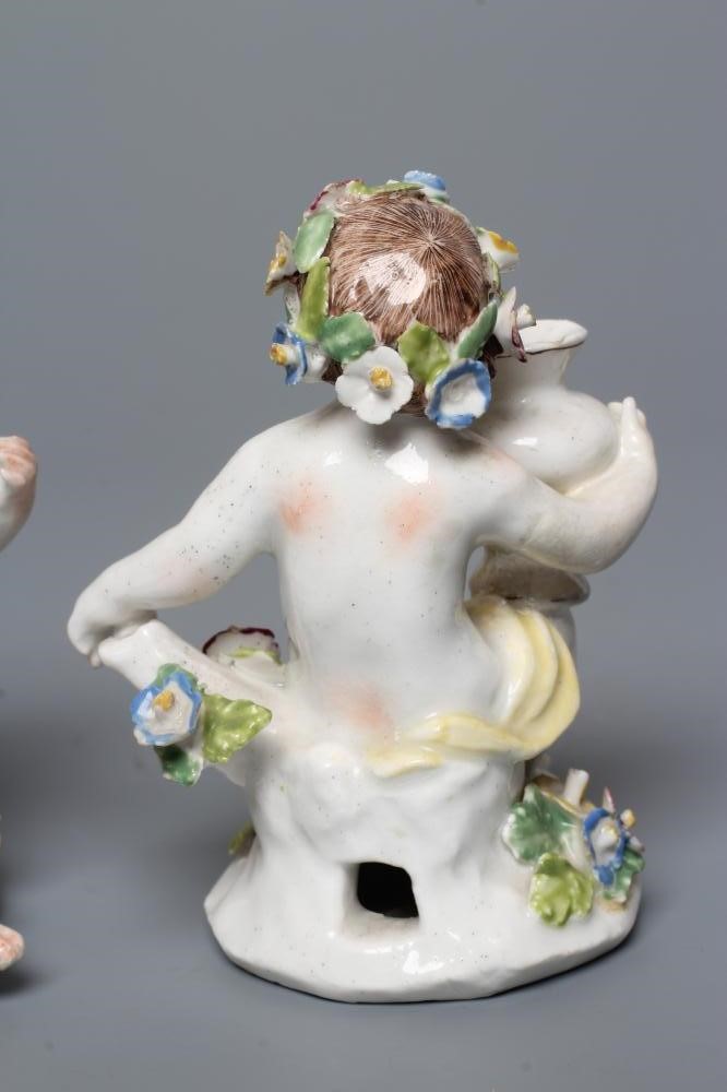A PAIR OF BOW PORCELAIN PUTTI Image
