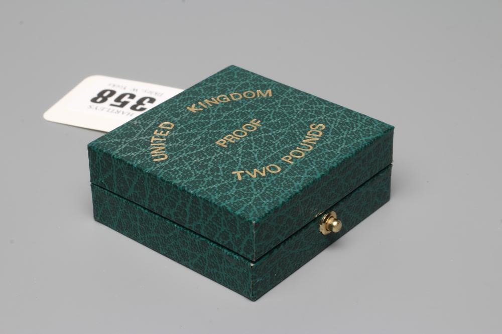 AN ELIZABETH II PROOF £2, 1986, 15.98g, in capsule and cased with certificate No.00875 (Est. plus Image