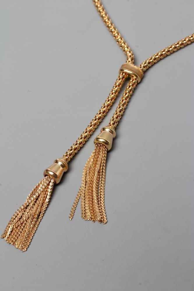 A TASSEL NECKLACE, the hollow bead type links terminating in two tassels, the lobster clasp stamped Image