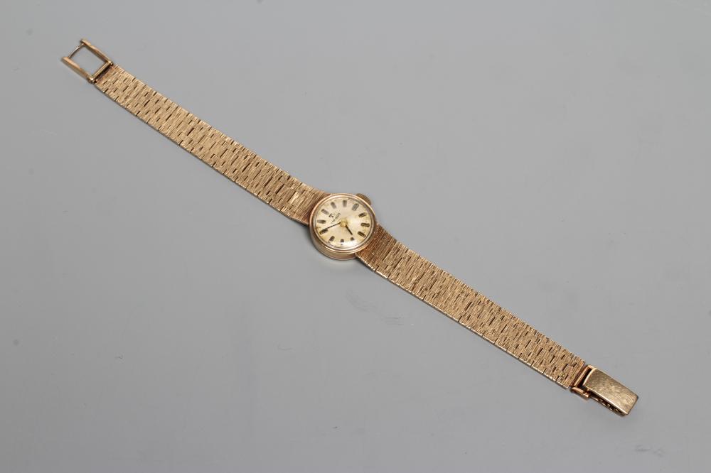 A LADY'S 9CT GOLD TISSOT WRISTWATCH Image
