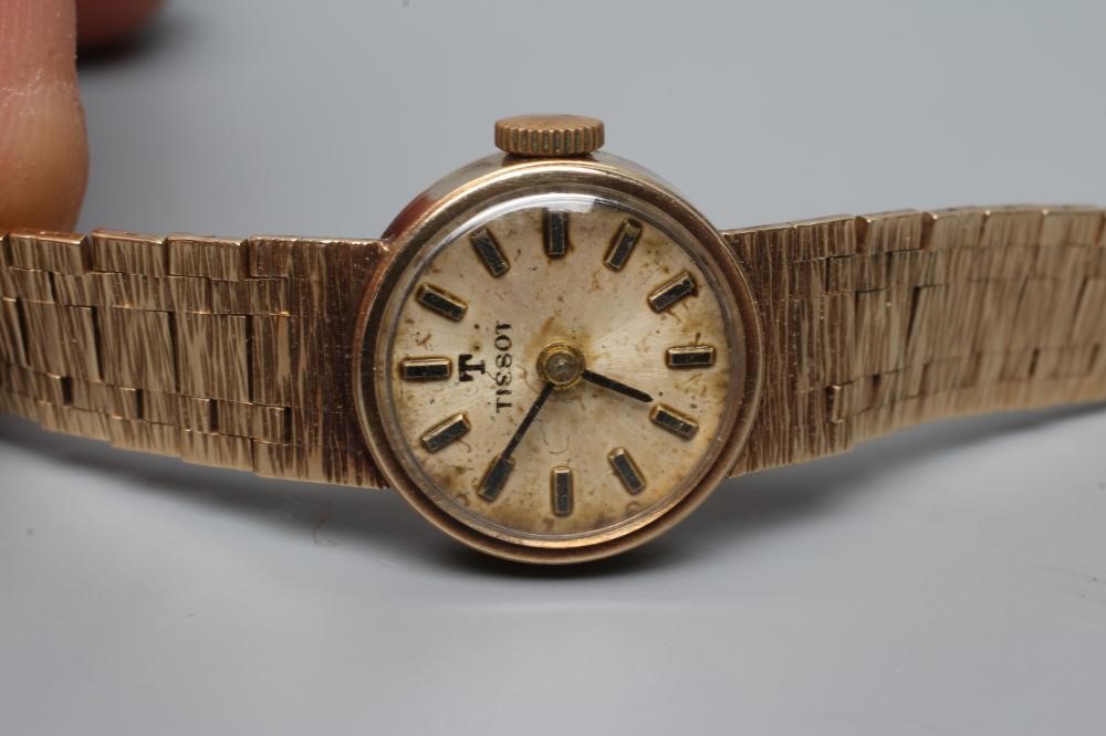A LADY'S 9CT GOLD TISSOT WRISTWATCH Image