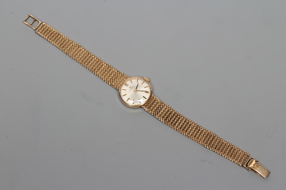 A LADY'S 9CT GOLD OMEGA WRISTWATCH Image