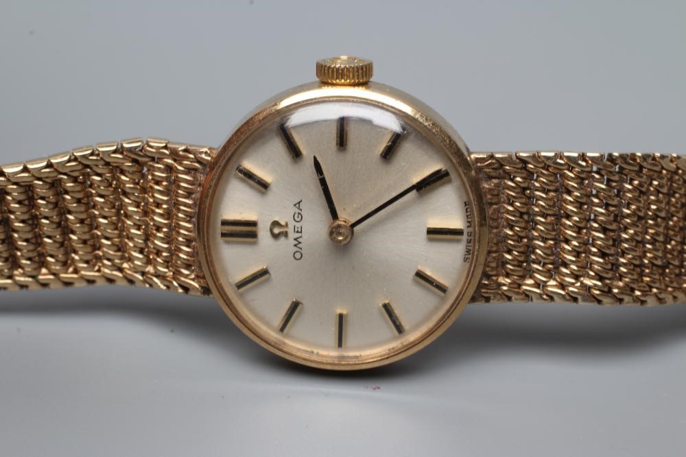 A LADY'S 9CT GOLD OMEGA WRISTWATCH Image