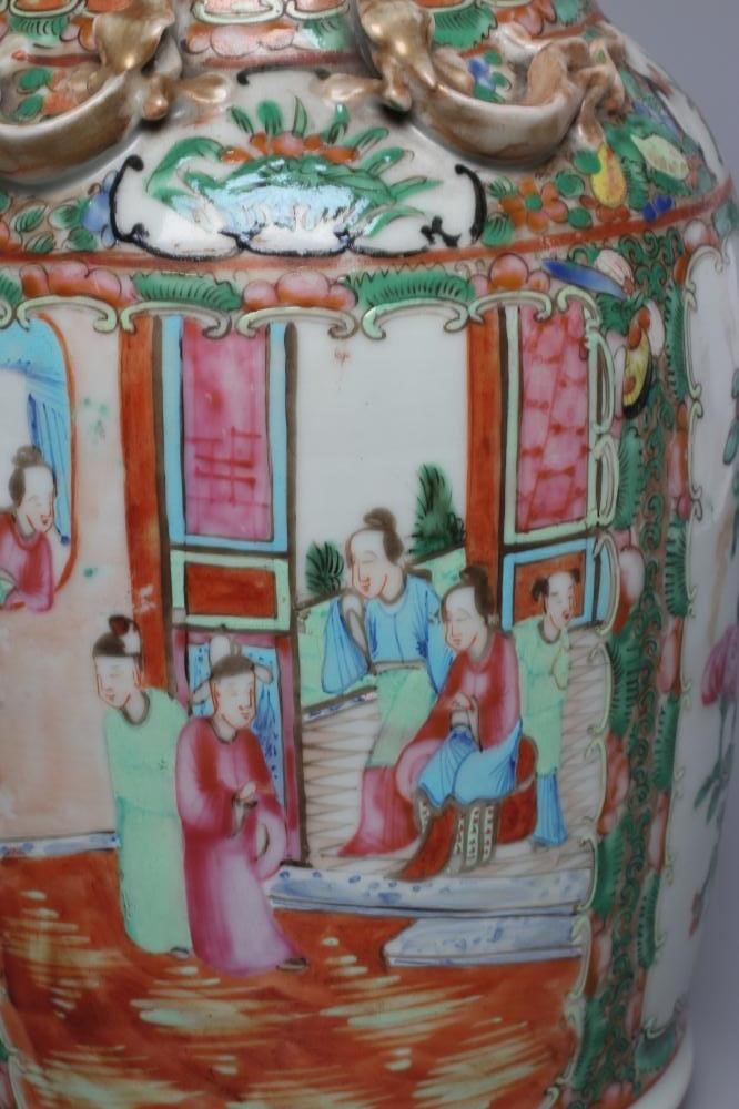 A PAIR OF CANTONESE PORCELAIN FAMILLE ROSE VASES of cylindrical form with waisted necks Image