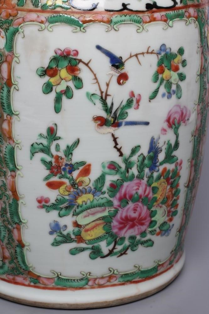 A PAIR OF CANTONESE PORCELAIN FAMILLE ROSE VASES of cylindrical form with waisted necks Image