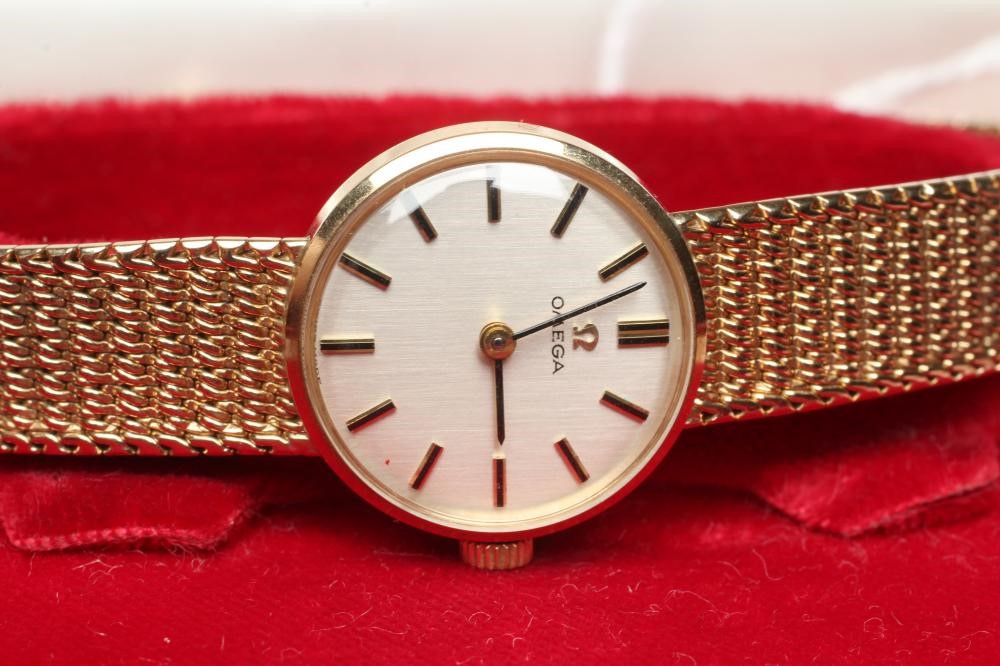 A LADY'S 9CT GOLD OMEGA WRISTWATCH Image