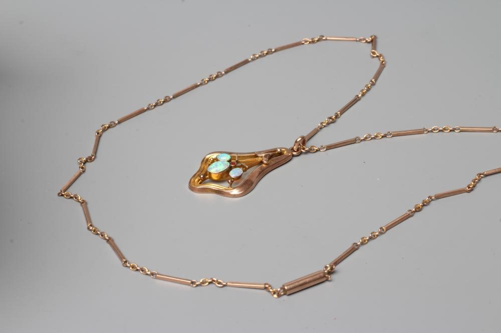 A MURRLE BENNETT PENDANT of shaped open form centred by three open back collet set oval cabochon Image