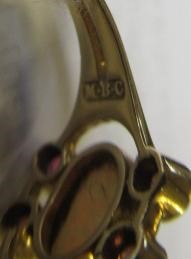 A MURRLE BENNETT DRESS RING, the oval cabochon polished opal collet set with two pairs of small Image