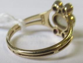 A MURRLE BENNETT DRESS RING, the oval cabochon polished opal collet set with two pairs of small Image