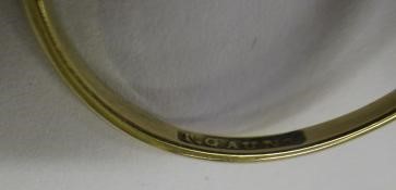 T. GAUNT - a black opal ring, the oval cabochon polished stone claw set to a plain shank, stamped Image