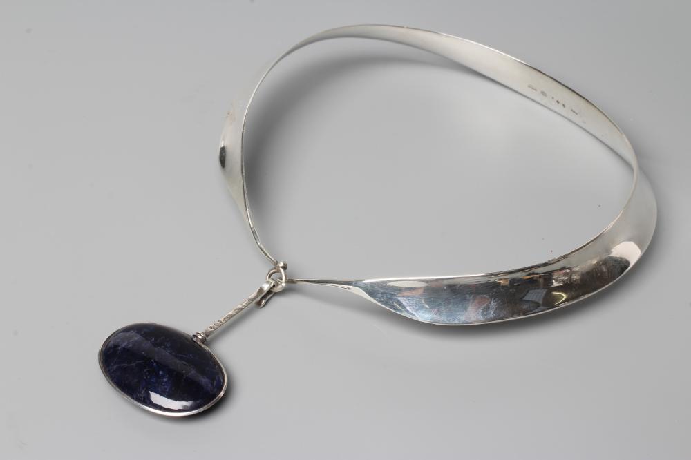 A GEORG JENSEN SILVER NECK RING designed by Vivianna Torun Bulow-Hube Image