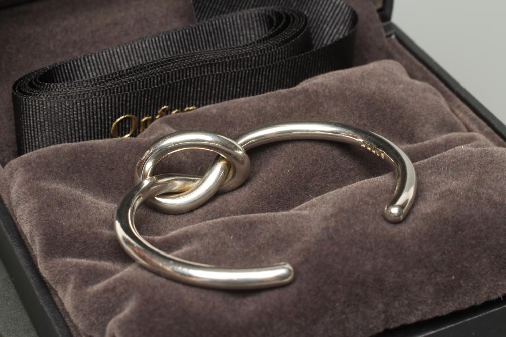 A GEORG JENSEN SILVER LOVE KNOT BANGLE, numbered A44BS, cased and boxed (Est. plus 24% premium inc. Image