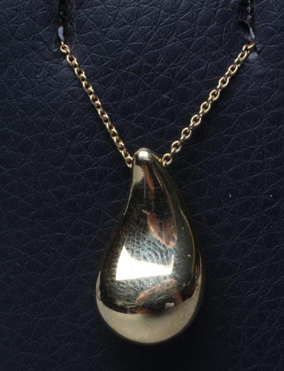 ELSA PERETTI FOR TIFFANY, a tear drop pendant, stamped 750, Spain, on a matching 18ct fine chain Image