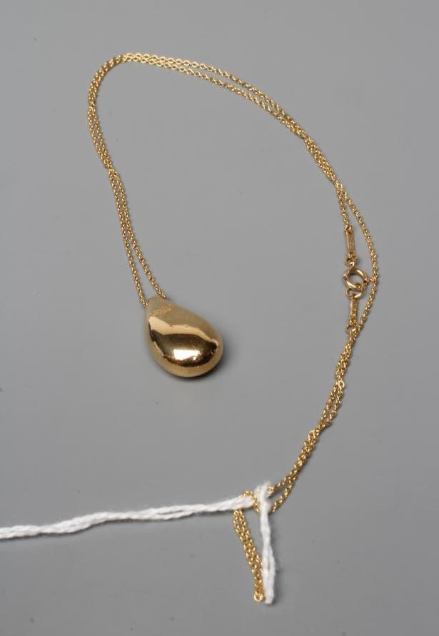 ELSA PERETTI FOR TIFFANY, a tear drop pendant, stamped 750, Spain, on a matching 18ct fine chain Image