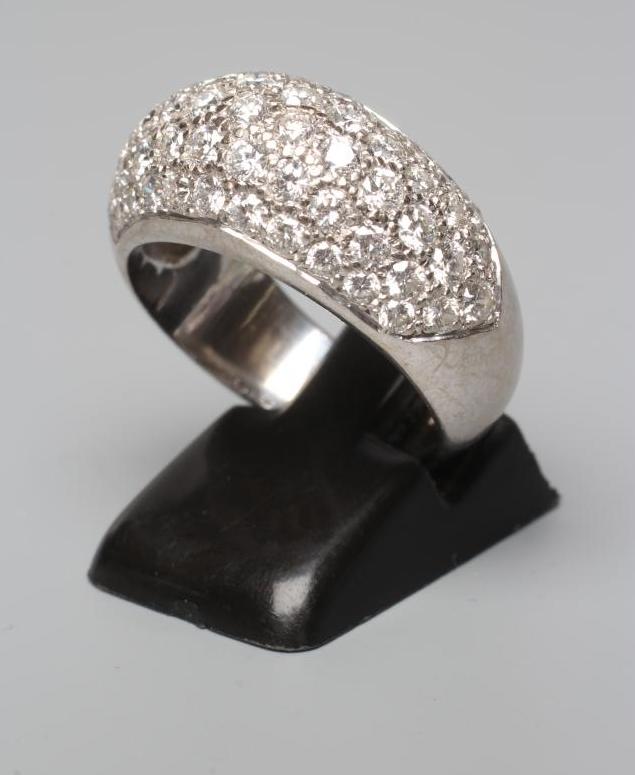 A DIAMOND COCKTAIL RING, the domed panel pave set with numerous stones totalling approximately Image