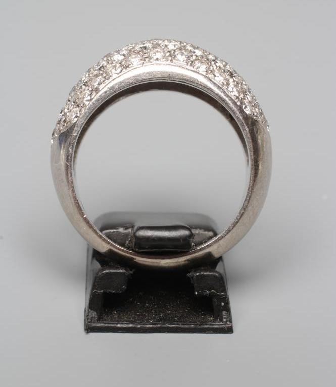 A DIAMOND COCKTAIL RING, the domed panel pave set with numerous stones totalling approximately Image