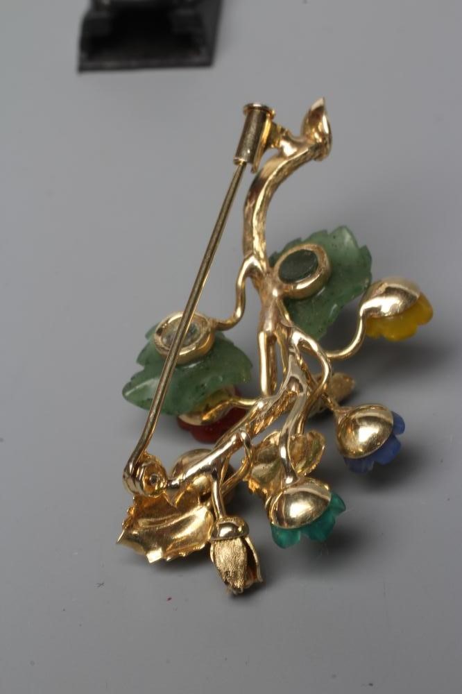 A TUTTI-FRUTTI SPRAY BROOCH, stamped 585, with carved and polished semi precious flowerheads and Image
