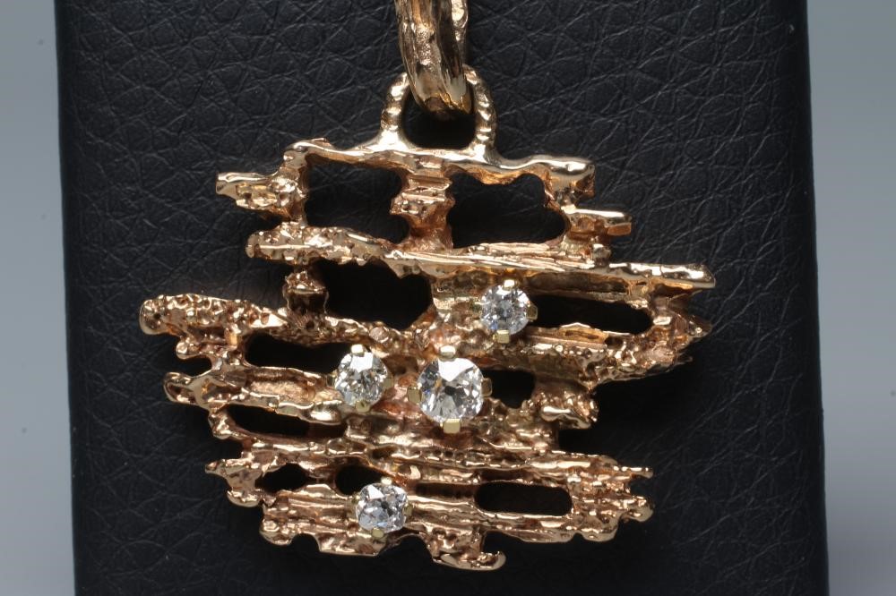 A BRUTALIST DIAMOND SET ABSTRACT PENDANT claw set with four graduated brilliant cut stones to Image