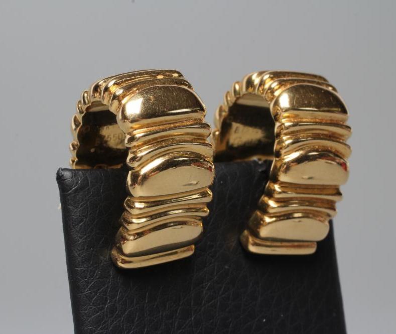 A PAIR OF CARTIER FRENCH CLIP HOOP EARRINGS, the wide panels with reeding, stamped Cartier, 1992, Image