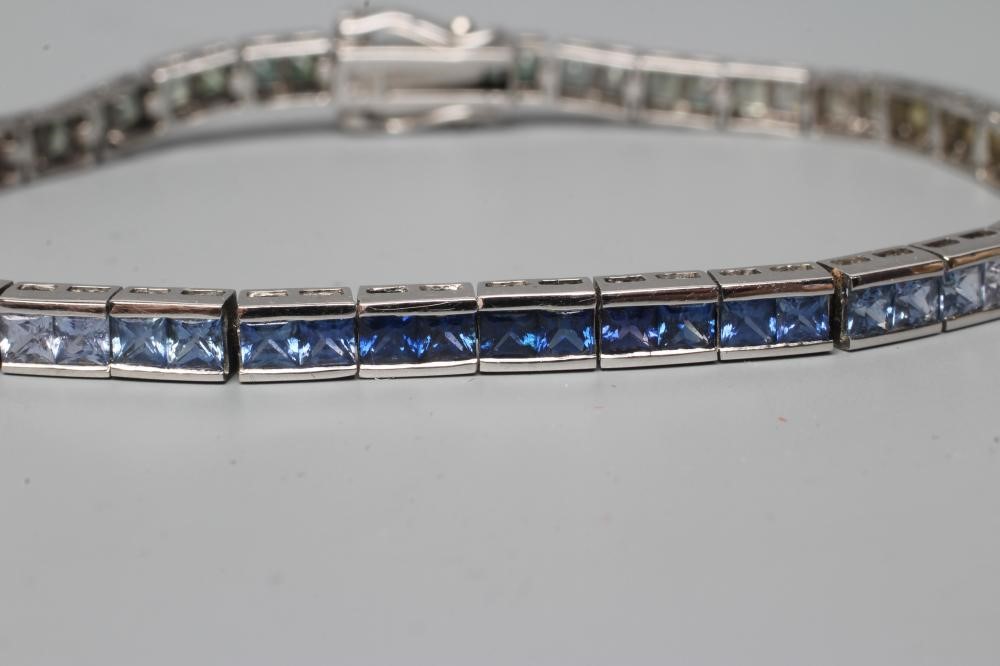 A RAINBOW SAPPHIRE TENNIS BRACELET Image