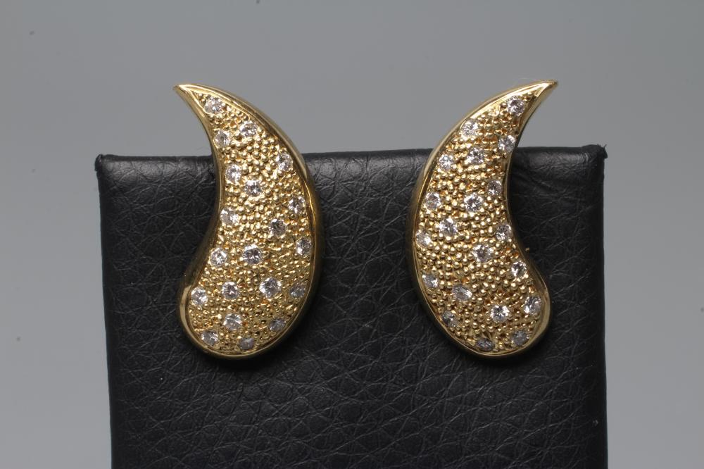 A PAIR OF DIAMOND CLIP EARRINGS, the pointelle coma shaped panels pave set with scattered small Image