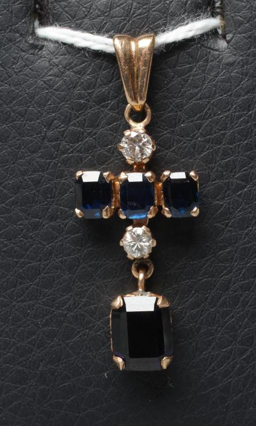 A SAPPHIRE AND DIAMOND DROP PENDANT, the four claw set oblong facet cut sapphires with two round Image