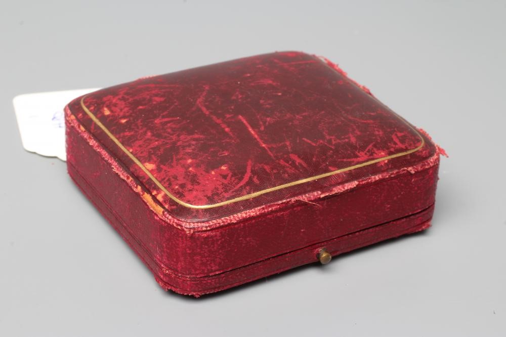 AN EDWARDIAN STIFF HINGED BANGLE, the upper section with nineteen graduated pearls to a plain, Image