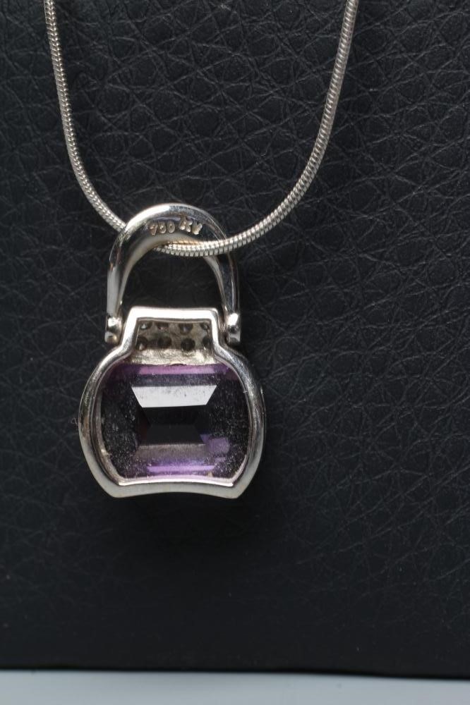 AN AMETHYST AND DIAMOND HANDBAG PENDANT Image